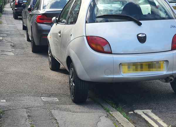 cars parked on pavement in st denys 20251006 140324