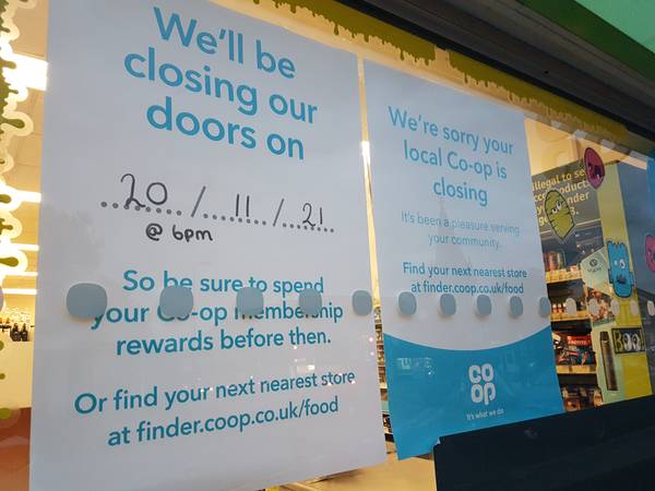 co op triangle closing posters in window 600