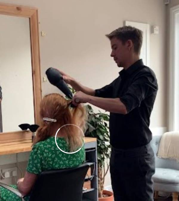 William Smith blow dries a customers hair 2 photo supplied 600px
